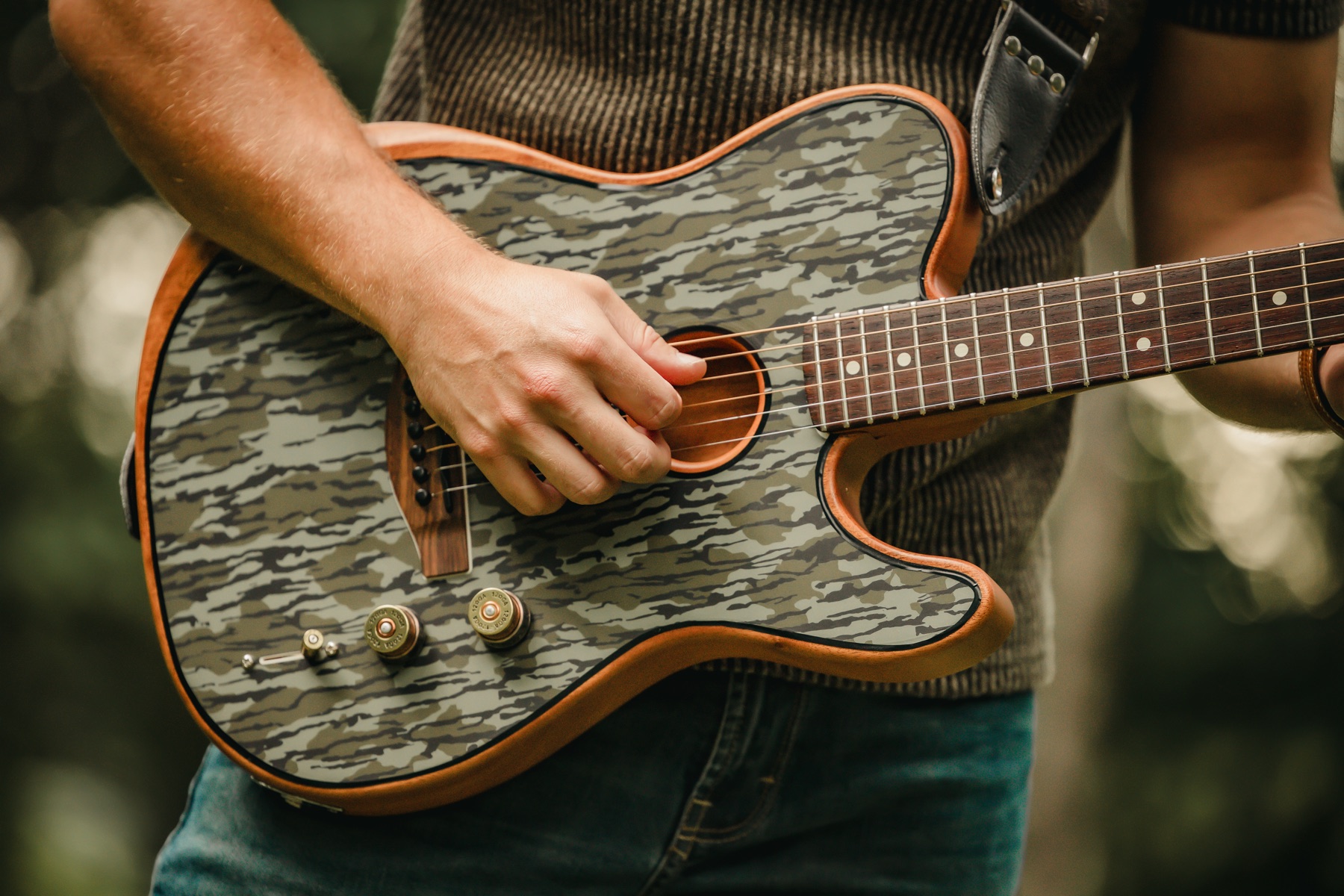 Close view of Dodge playing his custom guitar