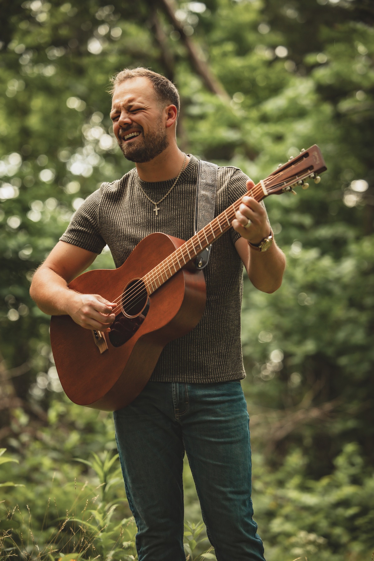 Dodge singing while playing acoustic guitar